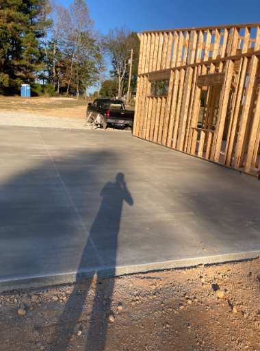 Wide concrete driveway and garage approach at new build