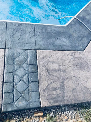 Stamped concrete pool deck with decorative border in Tennessee