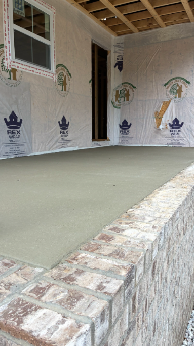 Front porch concrete pour over brick foundation
